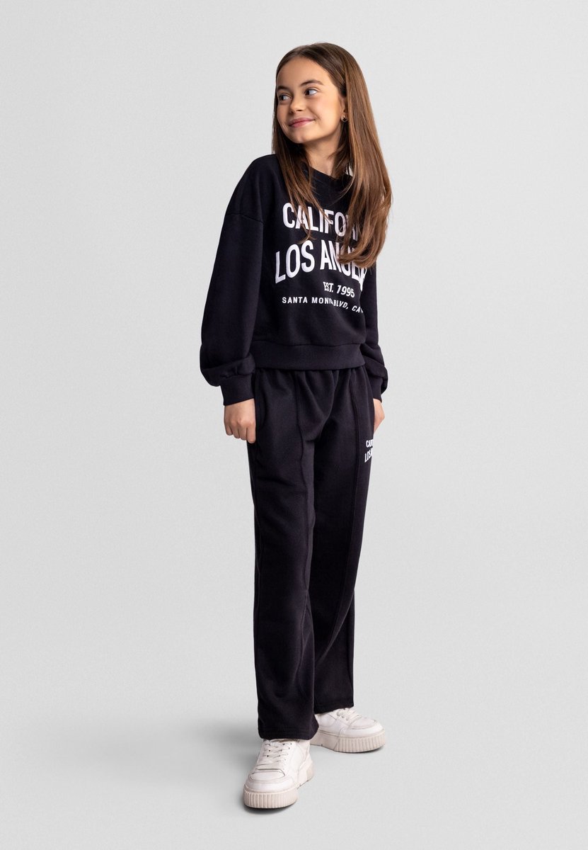 Minoti trainingspak meisjes zwart met California print - relaxed