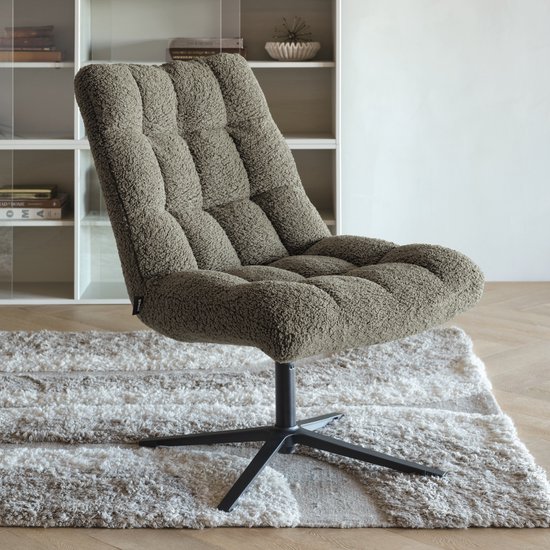 Groene teddy draaifauteuil met gecapitonneerd zitvlak en rugleuning, staand op een zwart kruisvoet.