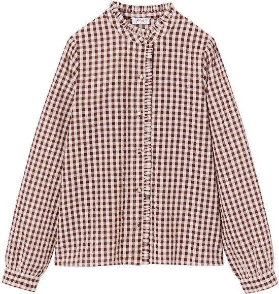 Chemise à carreaux marron et blanc avec col à volants, manches longues et fermeture boutonnée.