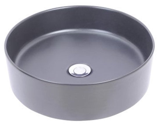 Ronde, matgrijze opzetwastafel met een zilverkleurige afvoerplug.
