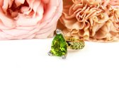 ring in geel en wit goud gezet met peridoot en diamant