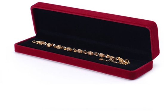 Gouden armband met ronde bedeltjes, in rode fluwelen juwelendoos.