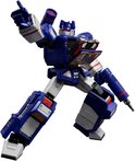 Blauwe en witte Transformer robot met cassettecompartiment open, wijst met rechterhand.