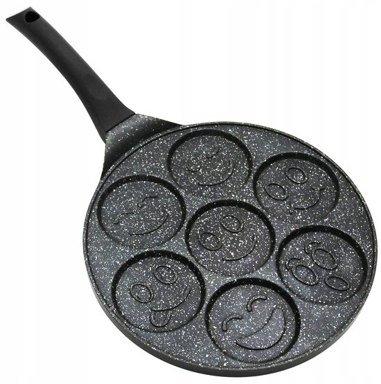 Grijze pannenkoekenpan met 7 lege smileyvormige holtes.