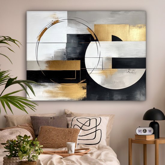 Peinture abstraite avec des formes géométriques dorées, argentées et noires, des cercles et des lignes au-dessus d'un lit.