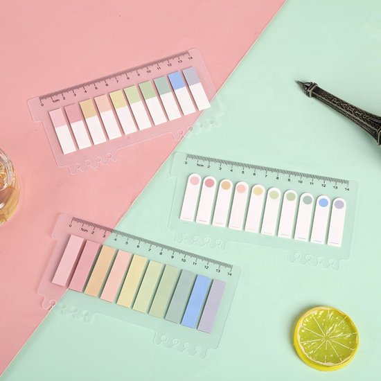 Drie vellen transparante sticky notes met liniaal, in pastelkleuren: roze, geel, groen, blauw en paars.