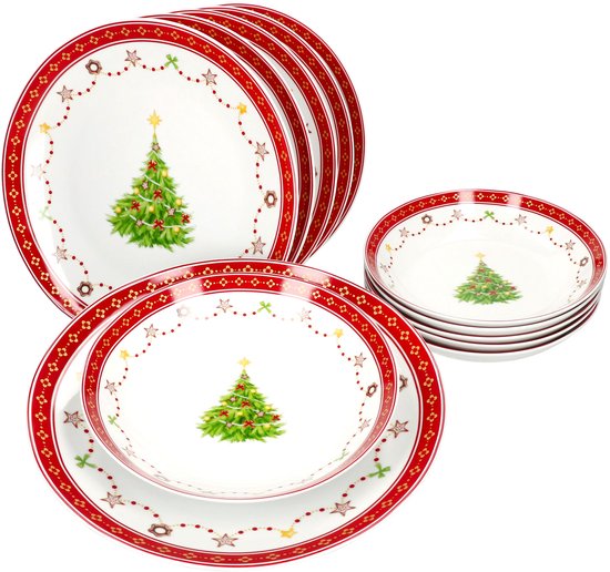 Grote set wit porseleinen servies met kerstboomdecoratie, bestaande uit stapels borden en soepborden.