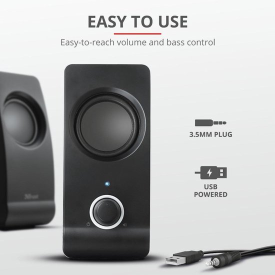 Zwarte Trust speaker met ronde speaker, volumeknop en indicatielampje. 3.5mm plug en USB-aansluiting.