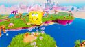 SpongeBob zweeft met een roze helm en bubbels om zich heen in een levendige onderwaterwereld.