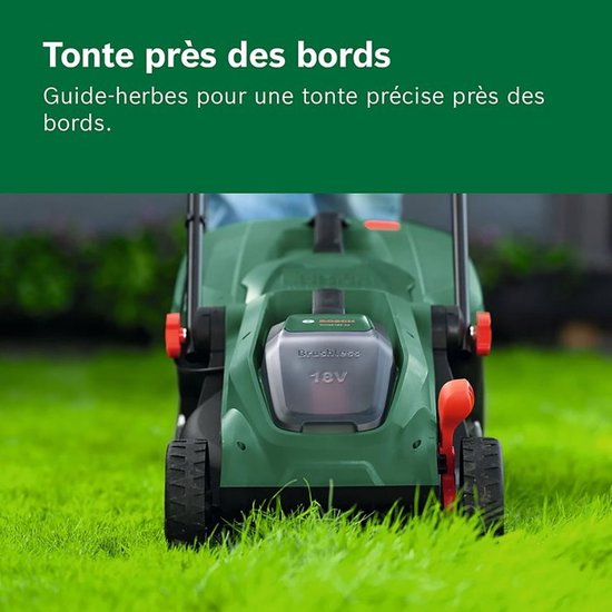 Groene Bosch grasmaaier 18V op gras, detail van de voorkant.