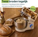 Crème keukenmixer met deegklopper in kom, brood ernaast. Tekst: 'Twee broden tegelijk'.