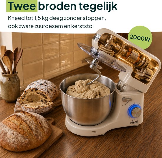 Crème keukenmixer met deegklopper in kom, brood ernaast. Tekst: 'Twee broden tegelijk'.