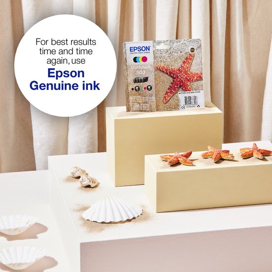 Epson multipack 603 cartridges op een display met zand, schelpen en zeesterren.