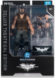 Actiefiguur van Bane in verpakking, met masker, bruin vest en grijze broek. "The Dark Knight Rises" logo zichtbaar.