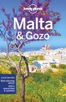 Boek 'Lonely Planet Malta & Gozo' met een afbeelding van een stad aan de kust onder een boom met paarse bloesems.