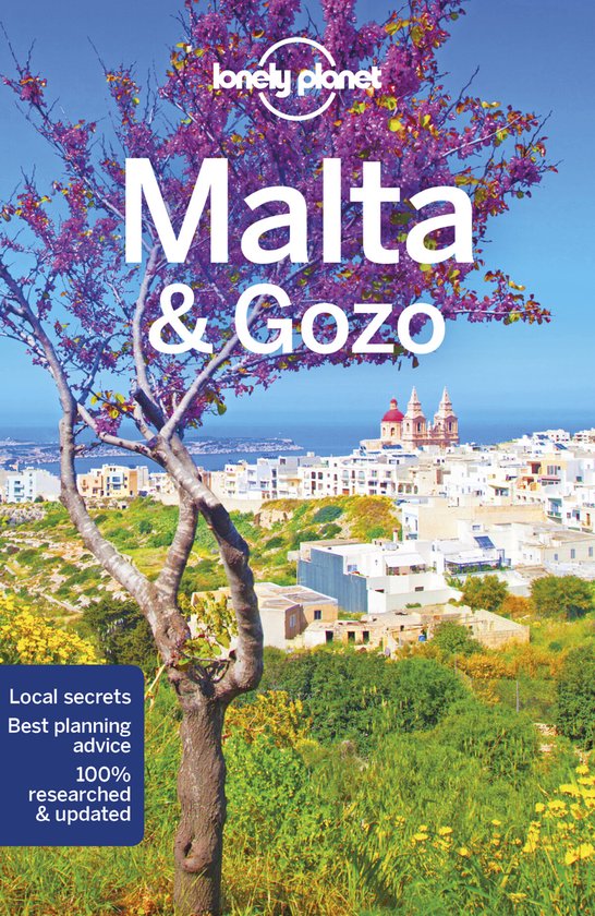 Boek 'Lonely Planet Malta & Gozo' met een afbeelding van een stad aan de kust onder een boom met paarse bloesems.