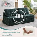 Smaragdgroene chenillestof futon met een 48 uur symbool en een hand die schuim indrukt.