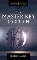 Boek "The Master Key System" van Charles Haanel, originele klassieke editie, met een afbeelding van een kluisdeur met licht dat eruit schijnt.