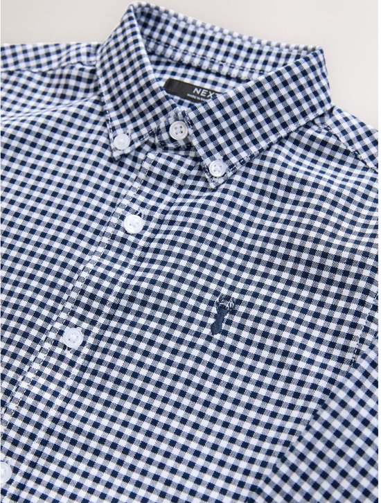 Blauw met wit vichy ruitpatroon overhemd met witte knopen en een geborduurd paardje op de borst.