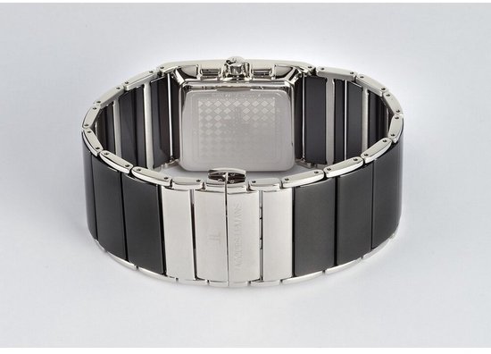 Achterkant van een zilverkleurig en zwart keramisch horloge met logo 'JACQUES LEMANS'.