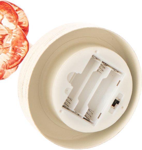 Dessous de la lampe avec le compartiment à piles.