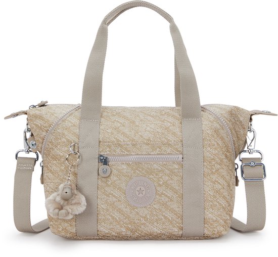Beige Kipling ART MINI damestas met goudkleurige spikkelprint, korte handvatten, afneembare schouderband en een fluffy aapje-sleutelhanger.