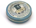 Blauwe metalen pot met baardbalsem, met een vintage illustratie van een piraat en de tekst 'REUZEL BAUME A BARBE'.