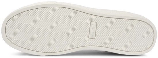 Onderkant van een witte sneaker met visgraatprofiel en 'GAASTRA' logo op de zool.