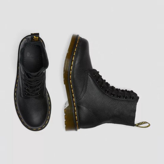 Bottes Dr. Martens noires, vues de dessus et de côté.
