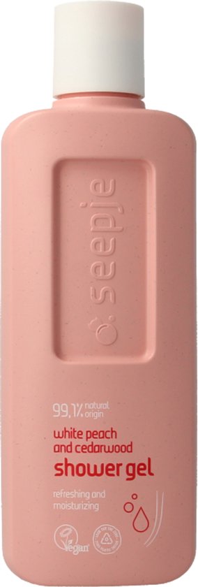 Roze fles douchegel met witte perzik en cederhout, 99.1% natuurlijk, verfrissend en hydraterend.