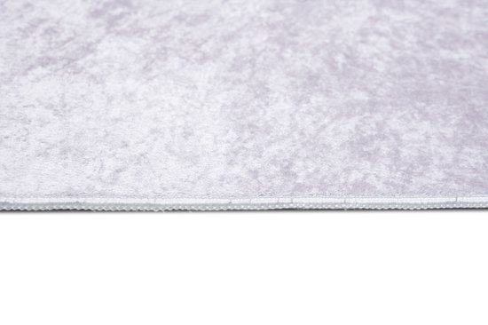 Tapis rose lisse avec texture.
