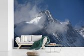 Behang - Fotobehang Pasterze-gletsjer omringt door wolken in het Nationale Park Hohe Tauern - Breedte 330 cm x hoogte 220 cm