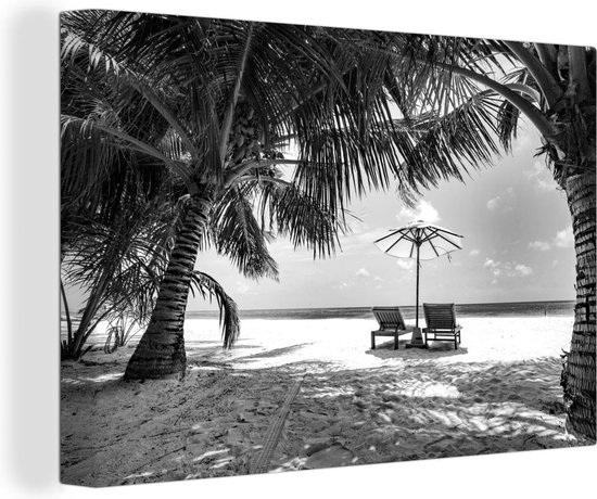 Canvas Schilderij Palmbomen bij een tropisch strand tijdens een zonsondergang - zwart wit - 90x60 cm - Wanddecoratie