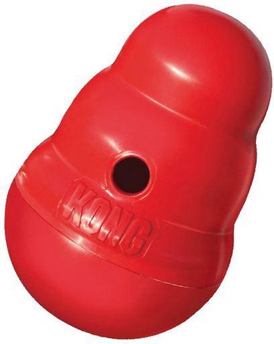 Een rood Kong-speeltje in de klassieke vorm met een gat.