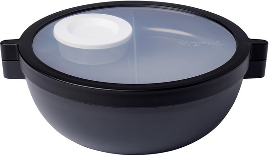 Lunchbowl bento Mepal noire avec un couvercle transparent et divisé et un petit récipient blanc au centre.