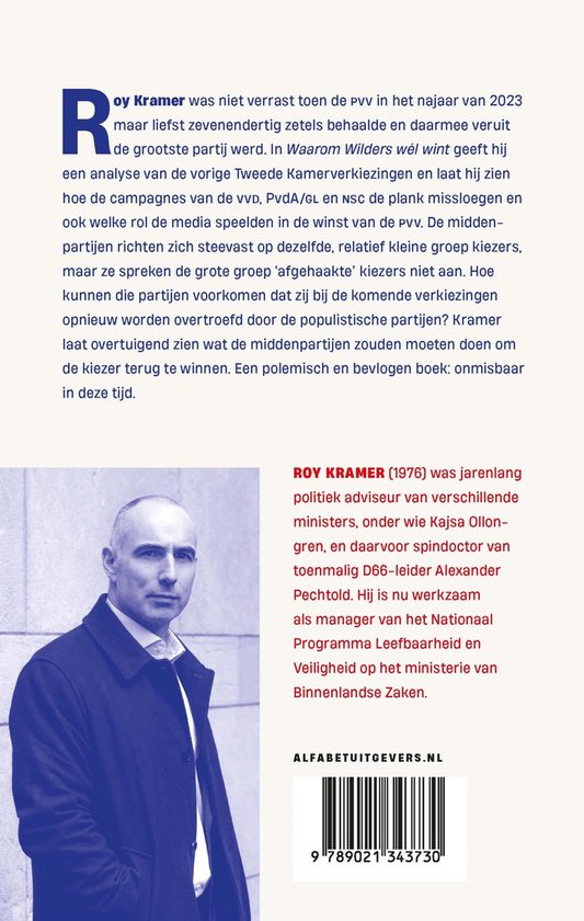 Portret van Roy Kramer, gekleed in een donkerblauw pak, met een grijze das.