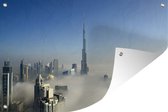 Muurdecoratie Mistige ochtend onder de Burj Khalifa in Dubai - 180x120 cm - Tuinposter - Tuindoek - Buitenposter