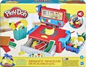 De doos van de Play-Doh kassa met de speelgoedkassa, deksels met fruit en groenten, potjes en bakvormen.