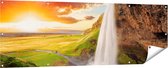 Gards Tuinposter Waterval in IJsland met Zonsondergang - 180x60 cm - Tuindoek - Tuindecoratie - Wanddecoratie buiten - Tuinschilderij