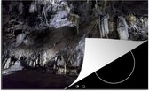 KitchenYeah® Inductie beschermer 76x51.5 cm - Stalactieten en stalagmieten in een grot uit de prehistorie - Kookplaataccessoires - Afdekplaat voor kookplaat - Inductiebeschermer - Inductiemat - Inductieplaat mat