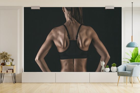 Papier peint photo vinyle - Le dos et les épaules d'une femme qui pratique clairement le fitness largeur 390 cm x hauteur 260 cm - Tirage photo sur papier peint (disponible en 7 tailles)