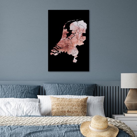 Affiche des Pays-Bas en teintes rose délavé avec bordure noire, suspendue à un mur bleu au-dessus d'un lit.