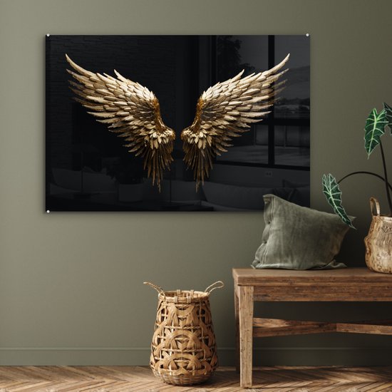 Gouden engelenvleugels op zwarte achtergrond boven een houten bankje.