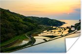 Poster Geweldige zonsondergang belicht de rijstvelden van China - 120x80 cm