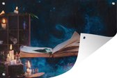 Tuinposter - Tuindoek - Tuinposters buiten - Zwevend boek tussen brandende kaarsen - 120x80 cm - Tuin