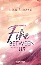 Between Us-Reihe 2 - A Fire Between Us