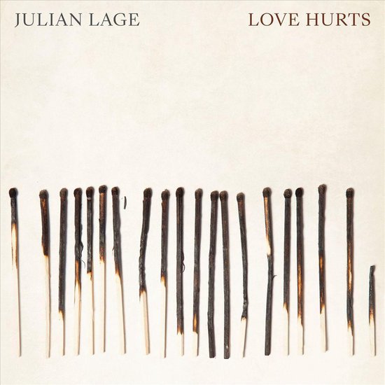 Albumhoes "Love Hurts" van Julian Lage, met op de voorgrond een rij gebruikte lucifers.