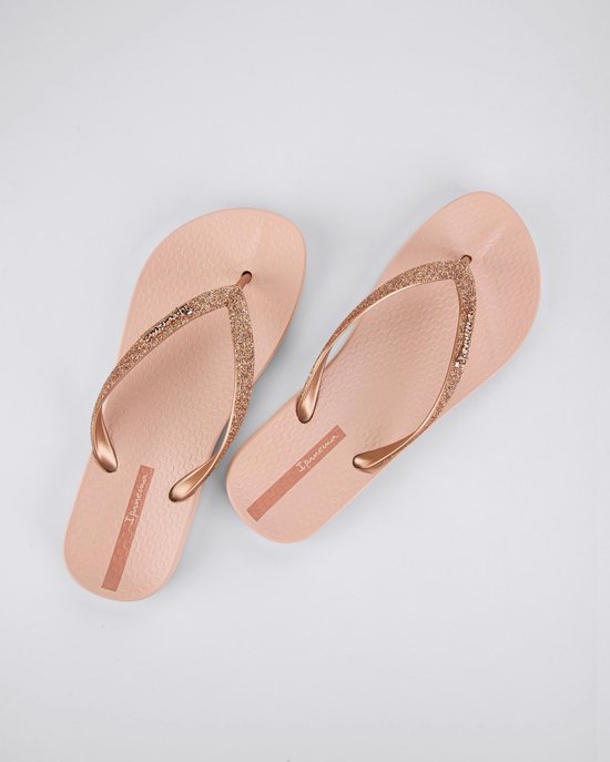 Lichtroze Ipanema teenslippers met glitterbandjes.