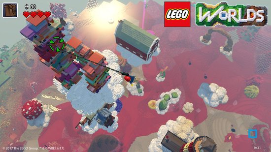 Een Lego figuur met een rode zak hangt aan een kabel die twee torens van Lego blokken verbindt.