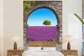 Behang - Fotobehang Bloemen - Lavendel - Boom - Doorkijk - Breedte 200 cm x hoogte 300 cm
